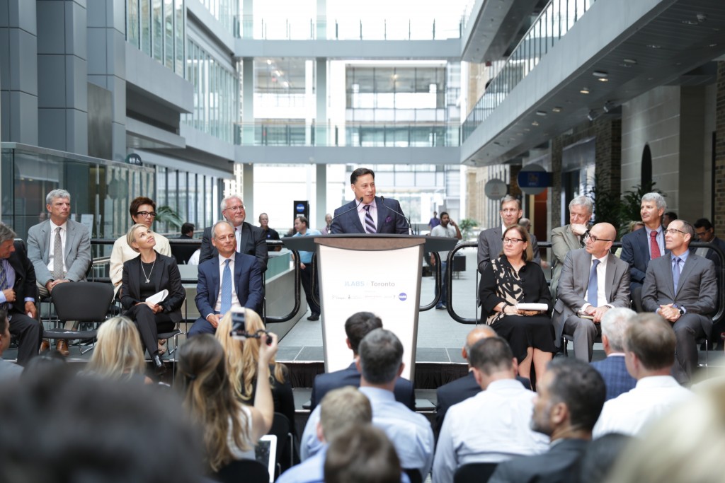  Minister of Economic Development, Employment and Infrastructure Brad Duguid announces the arrival of JLABS @ Toronto in the MaRS Discovery District. First row, left to right: Chris Halyk, president of Janssen Inc.; Melinda Richter, head of JLABS, Johnson & Johnson; Dr. Meric Gertler, president, University of Toronto; Minister Duguid; Dr. Ilse Treuricht, CEO MaRS Discovery District; Dr. Raphael (Rafi) Hofstein, president and CEO MaRS Innovation, and Robert Urban, head of Johnson & Johnson Innovation Boston. Second row: Dr. Robert Howard, president and CEO St. Michael's Hospital; Dr. Catherine Zahn, president and CEO CAMH; Dr. Barry McLellan, president and CEO Sunnybrook Health Sciences Centre; Dr. Peter Pisters, president & CEO University Health Network; Dr. Jim Woddgett, director of research, Lunenfeld-Tanenbaum Research Institute, Mount Sinai Hospital; and Dr. Michael Apkon, president and CEO, The Hospital for Sick Children.